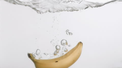 Slow Motion Banana Splashing Into Water