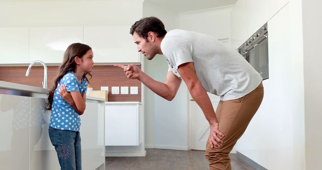 Father Disciplining Young Daughter in Kitchen - Download Free Stock Images Pikwizard.com