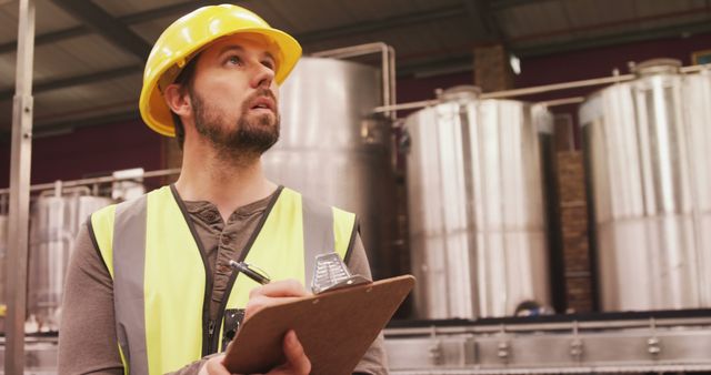 Factory Worker with Hard Hat Inspecting Industrial Equipment - Download Free Stock Images Pikwizard.com