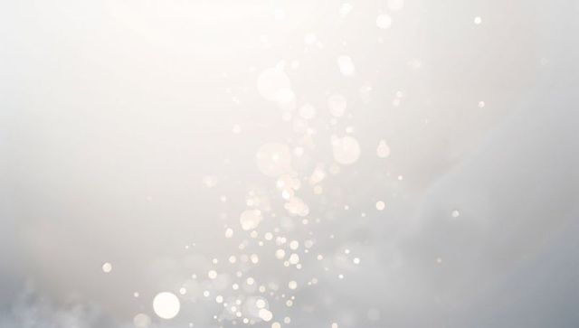 Floating soft bokeh trail over neutral misty gradient backdrop for elegant design