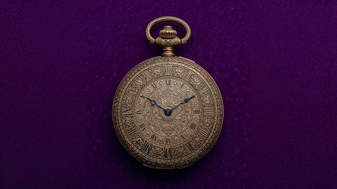 Ornate british empire vintage golden pocket watch with intricate craftsmanship