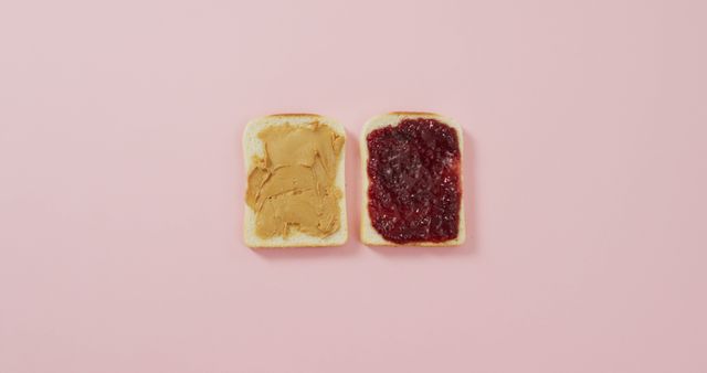 Close up view of peanut butter and jelly sandwich with copy space on pink surface. food and nutrition concept