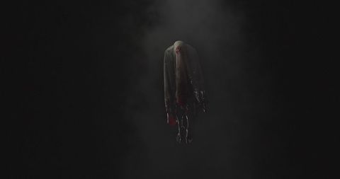 Eerie Ghostly Figure Emerging from Smoky Darkness