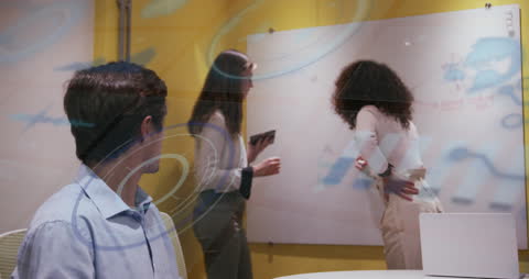 Innovative Business Team Brainstorming with Futuristic Digital Overlays