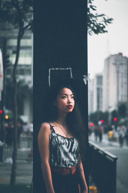 Contemplative Young Asian Woman Standing on Urban Street - Download Free Stock Images Pikwizard.com