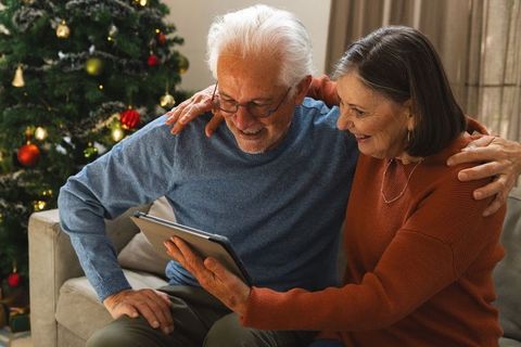 Senior Couple Celebrating Christmas with Digital Connection