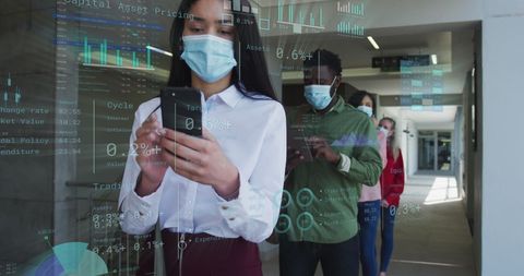 Business professionals analyzing financial data in queue with masks