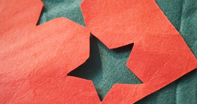 Heart and star cutout on green felt background, emphasizing the craft and handmade nature with bright red and green colors, ideal for holiday decorations, DIY projects, creative designs, and art bookmarks.