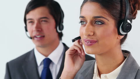 Customer Service Representatives Using Headsets at Work