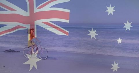 Pedaling cyclist riding sunlit australian beach with flag overlay, summer lifestyle