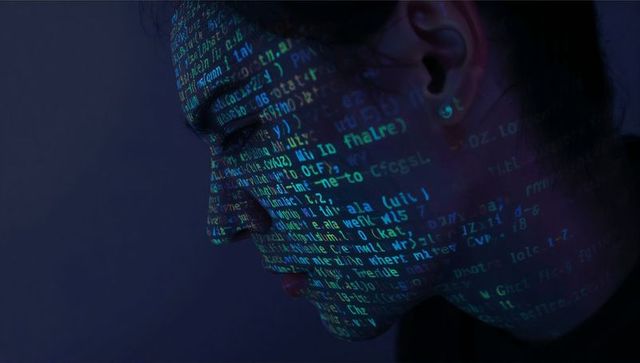 Asian woman gazing with neon code projecting across face cyber digital profile portrait