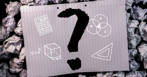 Black question mark with school icons on lined background