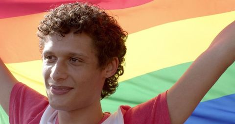Happy Man Holding Vibrant Rainbow LGBT Flag Outdoors - Download Free Stock Images Pikwizard.com
