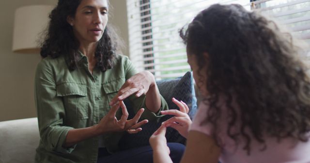 Mother Teaching Daughter Sign Language at Home - Download Free Stock Images Pikwizard.com