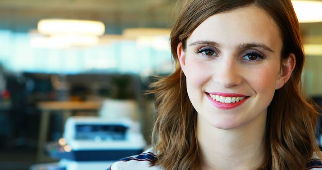 Smiling Young Woman in Office Environment - Download Free Stock Images Pikwizard.com