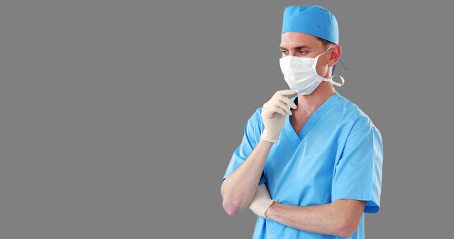 Pensive Medical Surgeon in Blue Scrubs and Facemask - Download Free Stock Images Pikwizard.com