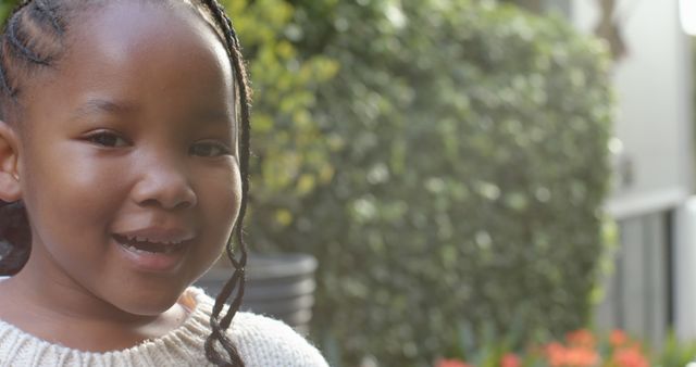 Smiling African American Girl with Braids in Sunny Garden - Download Free Stock Images Pikwizard.com