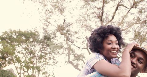Joyful Piggyback Ride of Afropolitan Young Couple - Download Free Stock Images Pikwizard.com