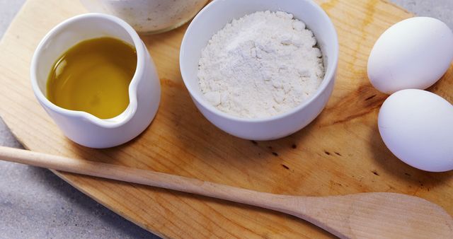 Baking Ingredients with Wooden Spoon and Cutting Board - Download Free Stock Images Pikwizard.com