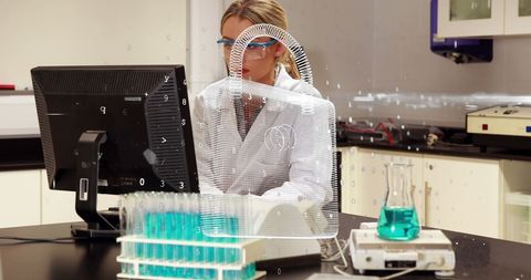 Scientist in Laboratory Using Computer with Security Concept