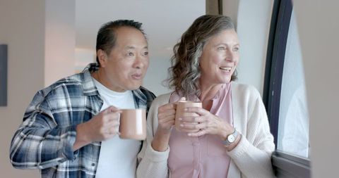 Senior Couple Enjoying Quiet Moments by the Window