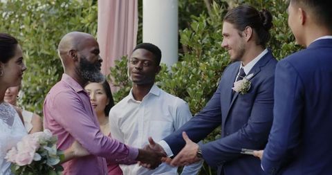 Outdoor Wedding Ceremony with Joyful Newlyweds and Friends