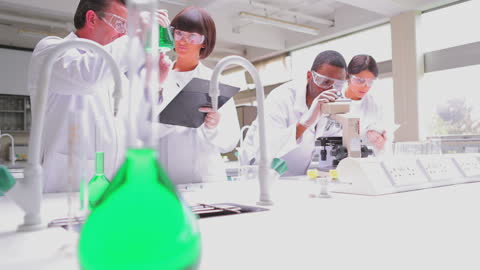 Diverse Students Engaged in Scientific Research in Modern Lab