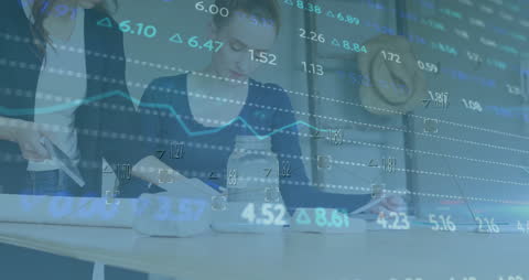 Financial Data Animating Over Business Meeting in Office Setting
