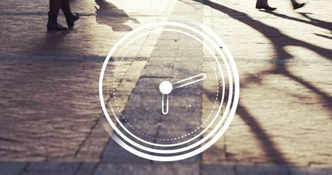 Urban morning clock overlay with long shadows and patterned pavement, time concept