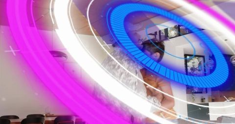 Father Cradling Child with Neon Digital Rings in Cozy Dining Room — Modern Family Bonding