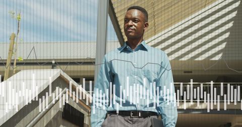 African American Businessman Analyzing Data Trends Outdoors