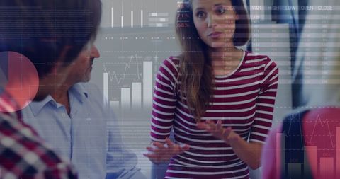 Business Team Discussing Financial Data with Digital Interface