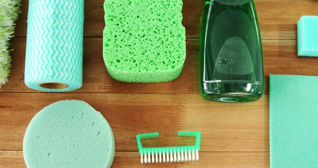 Green Cleaning Supplies on Wooden Surface - Download Free Stock Images Pikwizard.com