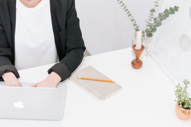 Minimalist Work Desk with Person Typing on Laptop - Download Free Stock Images Pikwizard.com