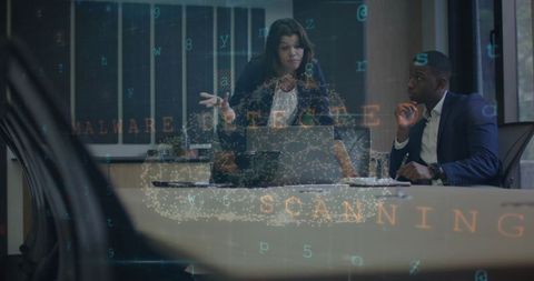 Diverse Colleagues Collaborate in Smart Office With Digital Graphics