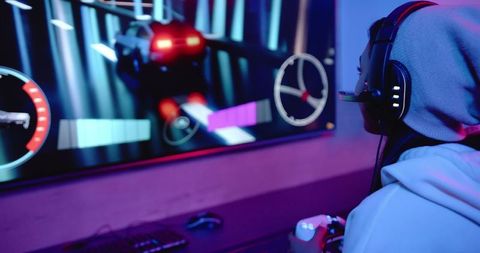 woman gaming intently at home with tech setup and cozy atmosphere - Download Free Stock Images Pikwizard.com