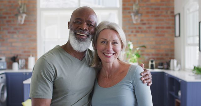Portrait of biracial senior couple smiling at home. retirement senior couple lifestyle living concept