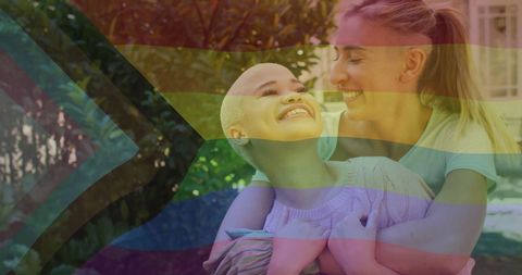 Diverse Female Couple Embracing with Pride Flag Overlay - Download Free Stock Images Pikwizard.com