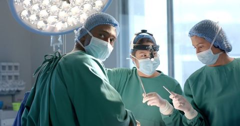 Multicultural Surgical Team Performing Operation in Modern Hospital