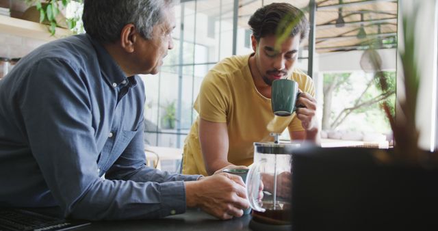 Two Men Sharing Coffee and Conversation in Relaxed Environment - Download Free Stock Images Pikwizard.com