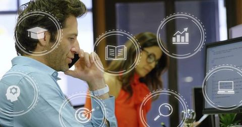 Young Professionals Collaborating at Open Office Desk with Analytics and Coding Overlays