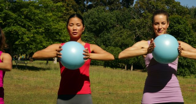 Fit Women Holding Fitness Balls During Outdoor Exercise - Download Free Stock Images Pikwizard.com