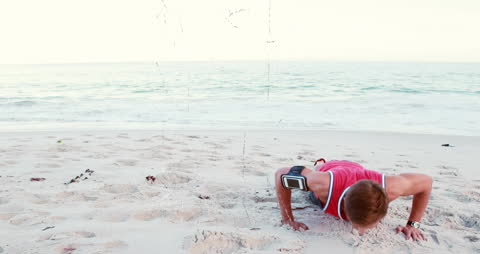 Beach Push-Ups with Fitness Tracker Technology Overlay