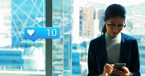 Professional Woman Engaged with Social Media at Office