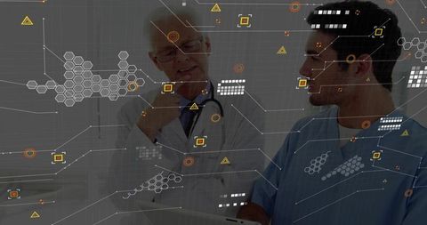 Doctor Consulting Nurse While Exploring Digital Data Interface in Hospital