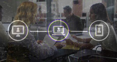 Business team collaborating around laptops with digital network overlay and data icons