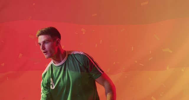 Soccer Player Celebrating Victory in Green Jersey with Red Background - Download Free Stock Images Pikwizard.com