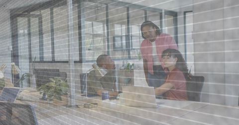 Team Discussing Project in Modern Minimalist Office, Collaborating Around Laptop
