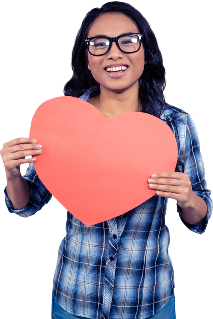 Smiling Asian woman holding red heart paper cutout showcasing love - Download Free Stock Videos Pikwizard.com