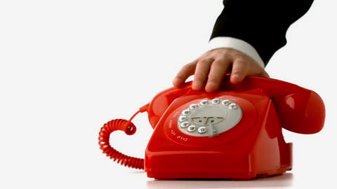 Red Rotary Dial Phone with Hand Placing Receiver Down